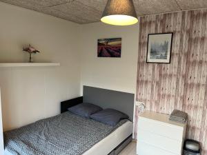 A bed or beds in a room at Pavillon Greve