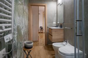 a bathroom with a white toilet and a sink at B&B Benvenuti al centro in Caserta +37 photos