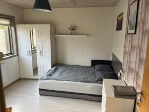 A bed or beds in a room at Pavillon Greve