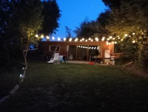 a house with lights in the yard at night at A Corcheira in Pontevedra +1 photo