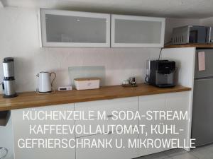 Kuchyň nebo kuchyňský kout v ubytování Casa Viva - Separate, ruhig gelegene Wohnung + 23 fotografií