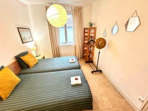Letto o letti in una camera di Chambres d'hôtes Avignon