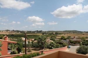 a view of a town from a balcony of a house at La Casa del Olivo en Montserrat - Valencia in Valencia