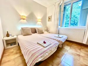 Letto o letti in una camera di Chambres d'hôtes Avignon