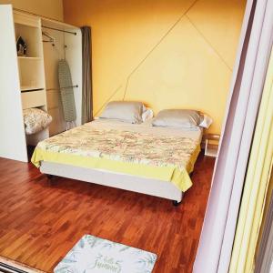 Katil atau katil-katil dalam bilik di Fare Toahana, logement chez l'habitant