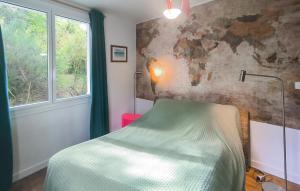 a bedroom with a bed and a window at Gorgeous Home In Saint-Brevin-Les-Pins in Saint-Brevin-les-Pins
