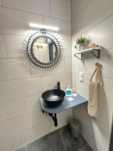 a bathroom with a sink and a mirror at Sweet Home in Klagenfurt