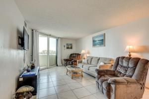 a living room with two chairs and a couch at Balcony and Resort Amenities Gulf Coast Escape! in Hudson