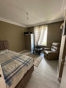 Postel nebo postele na pokoji v ubytování Nalbantoğlu Home