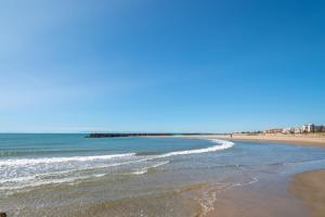 a view of the beach from the shoreline at Le Brise Marine - Terrasse - Plage - Piscine - Parking in Cap d'Agde