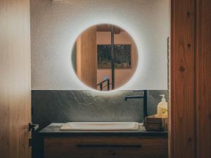 Ein Badezimmer in der Unterkunft Chalet Astra, Whirlpool & Sauna