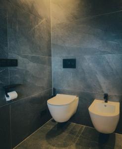Ein Badezimmer in der Unterkunft Chalet Astra, Whirlpool & Sauna