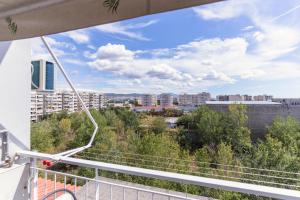 a view of a city from the balcony of a building at La Bella Casa Thessaloniki in Thessaloniki
