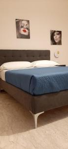 A bed or beds in a room at Appartamento ALECATIA 2