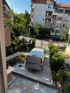 a van parked in a parking lot in a city at Top Spot Pleven in Pleven +8 photos
