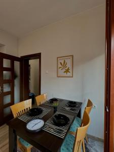 a dining room table with chairs and a table and a table and chairsktop at Top Spot Pleven in Pleven