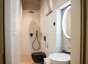 a bathroom with a black toilet and a sink at Villa Avrelia in Ljubljana +39 photos