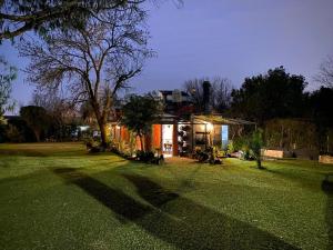a house in a yard with a green lawn at Maravillosa Casa Quinta in Del Viso +38 photos