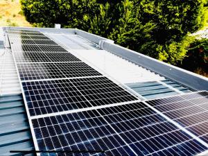 a group of solar panels on top of a roof at Hotel Vibes Cape Town Plattekloof in Cape Town