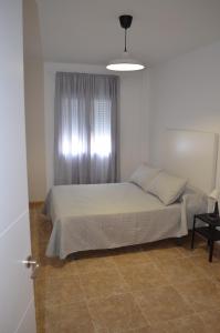 Ένα ή περισσότερα κρεβάτια σε δωμάτιο στο Casa Anita