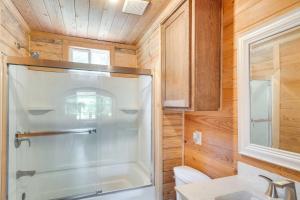 a bathroom with a shower and a sink at Quiet Hemphill Cabin Retreat Near Toledo Bend Lake in Hemphill +19 photos
