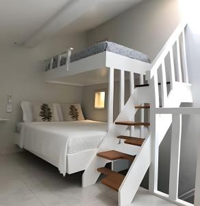 Un ou plusieurs lits dans un hébergement de l'établissement Studio lindo nas Rua das Pedras