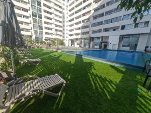 a swimming pool in the middle of a building at City Bleu Maroc in Tangier