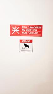 a sign on a wall that says no airplanes nor humans at Rooms4you 3 in historic center of Braga in Braga