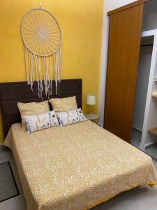 a bedroom with a large bed with a large headboard at Appartement Canelle in Baimbridge +7 photos