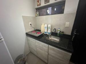 a bathroom with a sink and a counter at Casa completa Ecovia Ruta Luque San Bernardino in Zarate Isla