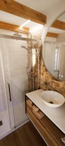 a bathroom with a sink and a mirror at Casita con jardin en Sada in San Andrés de Carnoedo +43 photos