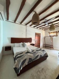 Postel nebo postele na pokoji v ubytování Hotel Mittoz Holbox