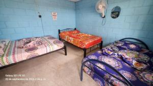 Postel nebo postele na pokoji v ubytování Hostal Laberintos Del Cuzco
