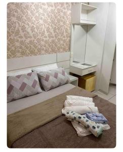 Ένα ή περισσότερα κρεβάτια σε δωμάτιο στο Apartamento centro sul lugar harmonioso
