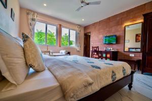a bedroom with a large bed in a room at Kankariya Heritage in Jodhpur