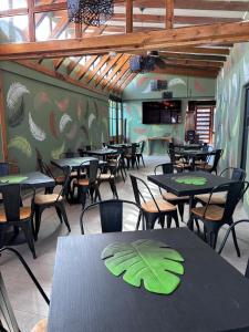 a restaurant with tables and chairs in a room at Hotel Minga in Copiapó