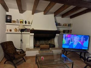 Televízia a/alebo spoločenská miestnosť v ubytovaní Gemütliches Ferienhaus am Club Nautico, Santa Ponça