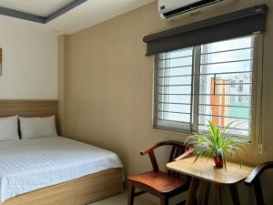 Postel nebo postele na pokoji v ubytování Thanh Hiền HB Hotel