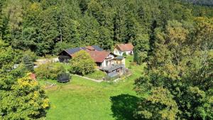 an aerial view of a large house in the woods at Altes Forsthaus Bodenmais in Bodenmais