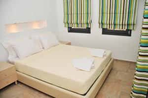 Postel nebo postele na pokoji v ubytování Kleopatra Villas - Seaside Suites