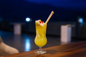 a drink with a straw sitting on a table at Casa Tranquila in Gangtok