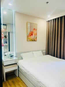 Ένα ή περισσότερα κρεβάτια σε δωμάτιο στο Ben's Homestay Ecopark - Haven Park H2