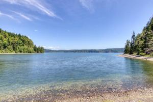 a view of a lake with trees on the shore at Serene & Luxury Retreat, Waterfront, Hot tub, Clamming in Lilliwaup