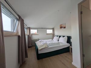 a bedroom with a bed and a window in it at Munich Large Apartment 150 qm in top centrally located 1 to 15 guests in Munich