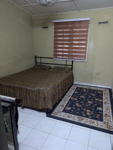 Ένα ή περισσότερα κρεβάτια σε δωμάτιο στο PULAU INDAH HOMESTAY