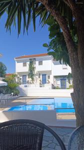 a view of a house and a swimming pool at Eleor in Siviri