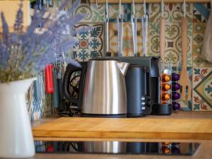 a coffee pot sitting on top of a counter at Pause et Sérénité Studio de 28m2 in Cagnes-sur-Mer