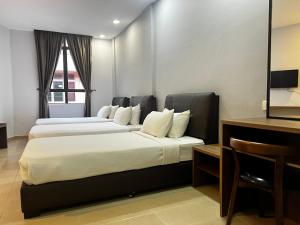 Postel nebo postele na pokoji v ubytování SiN LiEN HOTEL