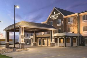 a rendering of a courtyard hotel with a parking lot at Country Inn & Suites by Radisson, Minot, ND in Minot