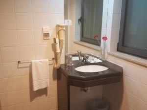 Um banheiro em Hotel Jose Alberto